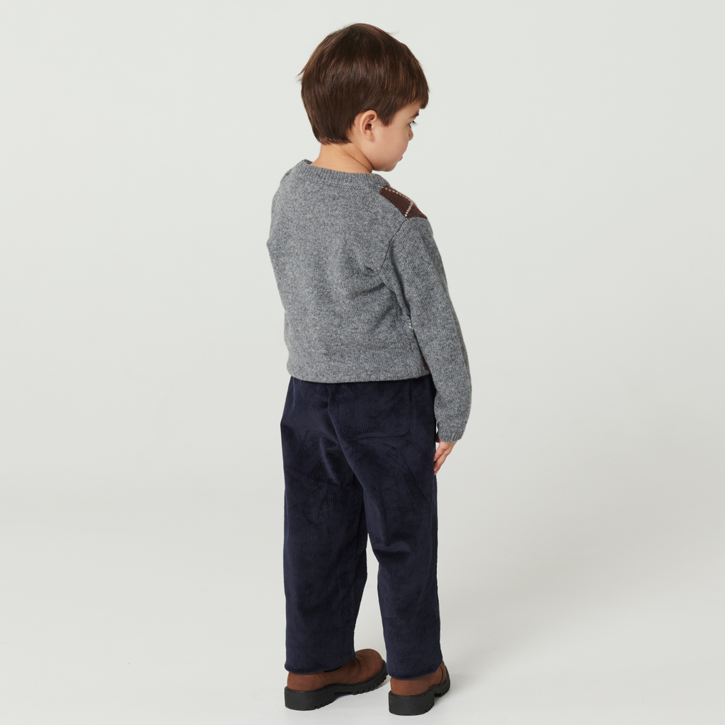 Gebreide trui met ruitpatroon - Argyle Sweater - Lamswol - Copenhagen Colors - achterkant kind met lange broek