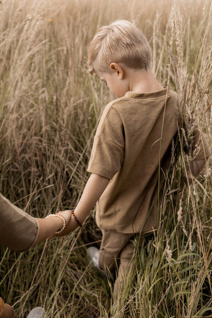 Alwero - Coni barnsteen armband baby - Vanille - 14cm - lifestyle