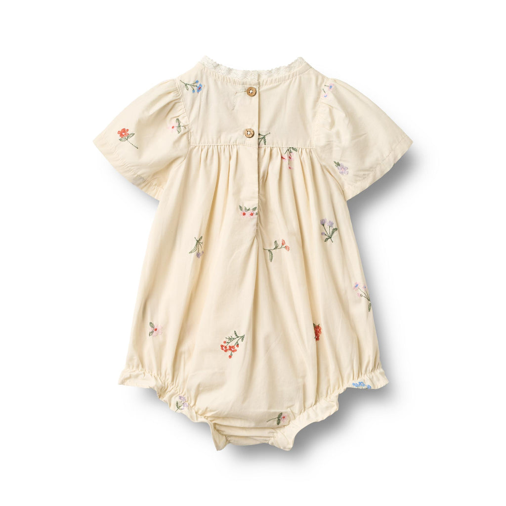 Romper Margit - Borduurde bloemen - Biolgosch katoen - Ivory/Wit - Wheat achter